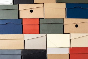 Pile of evenly folded shoe boxes, can be used as a background or wallpaper. Seasonal sales and...