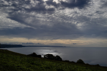 cloudy sunrise on the south Cornish coast inWhitsand bay