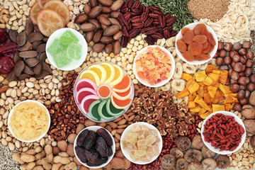 Dried fruit, seed and nut selection, health food high in antioxidants, protein, minerals, vitamins, omega 3 and anthocyanins. Flat lay.