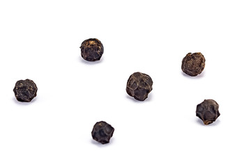 black pepper grains isolated on white background