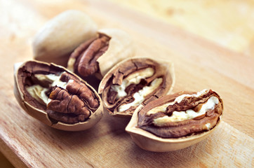 pecan close-up macro high resolution on wooden background