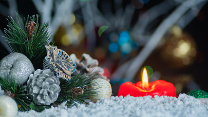 Blurred Christmas Background With Red Candle And Decorations