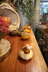 Fototapeta na wymiar Decorative colorful pumpkins on wooden table.