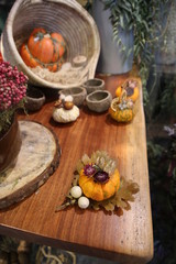 Decorative colorful pumpkins on wooden table.
