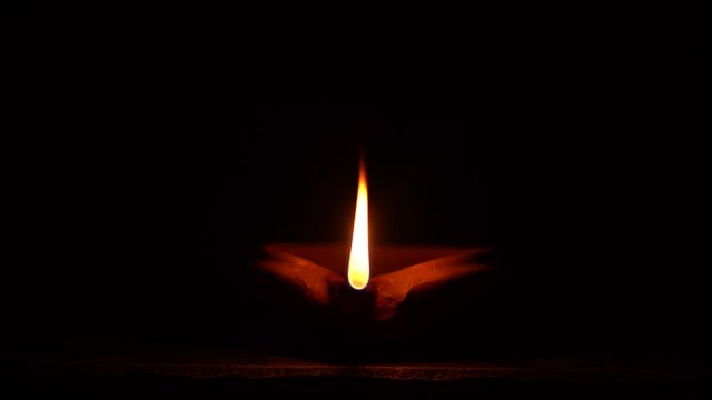 Big lighting mud lamp against a dark background