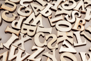 wooden letters of the English alphabet workpiece closeup macro