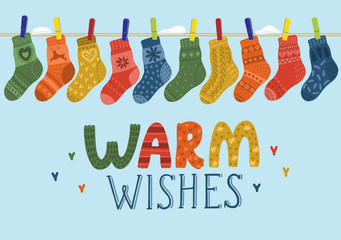 Warm wishes. Wool socks hanging on the rope. Vector illustration
