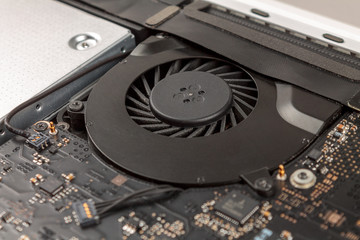 laptop cooling system close-up with rotating fan, CPU cooling and overheating, trottling
