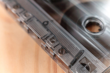 vintage old film music cassette on a wooden background, music background, music lovers, close up, macro