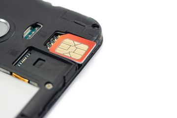 SIM card close-up next to the connector in the smartphone, phone