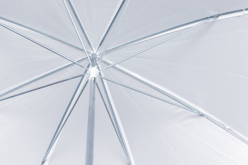 Bright white open umbrella texture background, bottom view