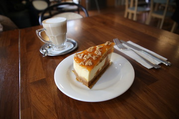 Cheesecake with walnuts and pumpkin and flat white.turkey