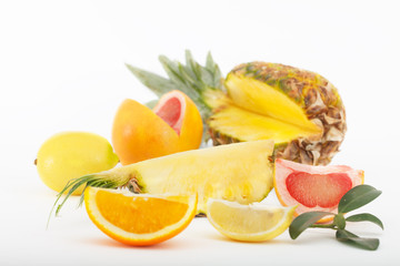 Slices of pineapple, orange, grapefruit and lemon. Citrus fruit for healthy life.