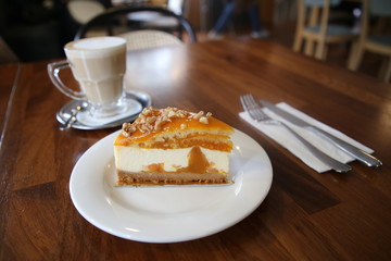 Cheesecake with walnuts and pumpkin and flat white.turkey
