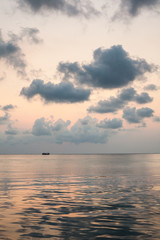 Obraz premium Beautiful seascape at dawn with pink sky and cumulus clouds, Koh Rong island, Cambodia