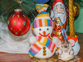 Christmas and New Year card with cute rat, snowman and Santa Claus. Ornaments symbol of the year on the Chinese calendar ate in the background. Winter holiday concept