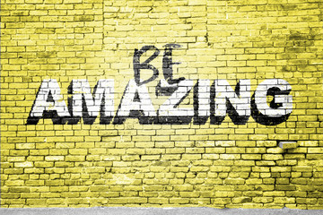 Fototapeta premium Be Amazing saying lettering Graffiti on Brick Wall