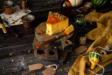 slice of pumpkin cheesecake with caramel sauce and seeds on top 