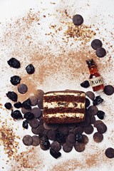 Slice of chocolate cake with prunes and rum