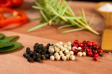 spices and herbs on wooden board