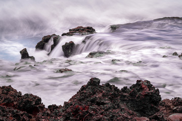 Mystic rocks at the ocean, long exposure. Grand Cayman Island