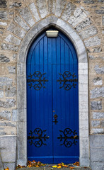 Blue wooden church door archway in rural Ireland
