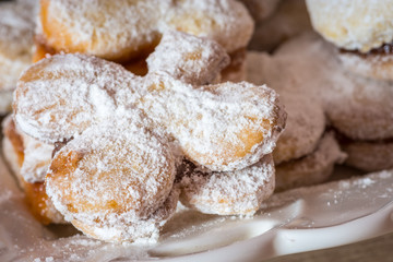 Fototapeta na wymiar Vanilice (small Vanilla cookies) are bite-sized Serbian Vanilla cookies made as sandwich of two vanilla and walnut cookies held together with a dollop of jam, usually served around the Christmas
