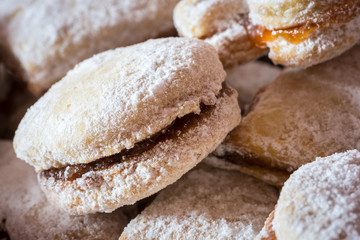 Vanilice (small Vanilla cookies) are bite-sized Serbian Vanilla cookies made as sandwich of two vanilla and walnut cookies held together with a dollop of jam, usually served around the Christmas