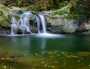 Fototapeta na wymiar Beautiful Inunaki waterfalls, cascading from Mt. Inunaki in Izumisano, Osaka Prefecture, Japan.