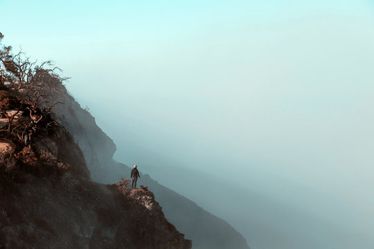 Man standing at Ijen volcano, Java, Indonesia