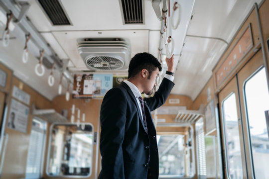 Young businessman on a train