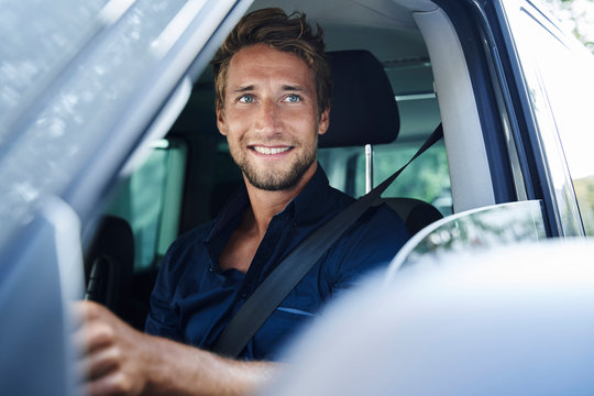 Smiling Young Man In Car