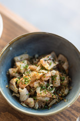 Bowl of Seafood Fried Rice Garnished with Chives.