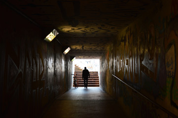 Man passing through underpass