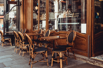 Fototapeta Cozy street with tables of cafe in Paris, France obraz