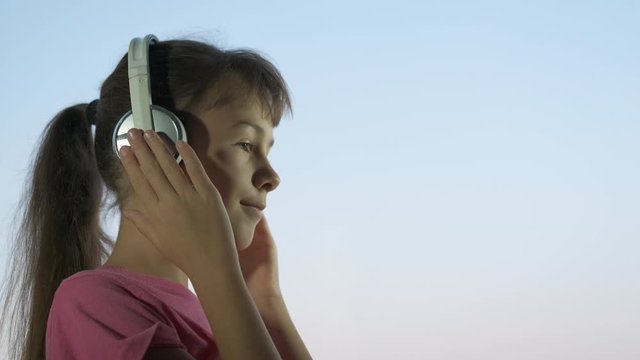 Music in child headphones.