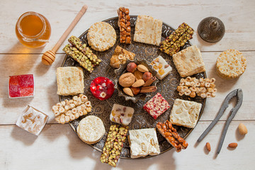 Halawet Al Mawlid Al Nabawi - Collection of traditional candies and sweets with honey jar - Egyptian Culture Dessert usually Eaten During Prophet Muhammad Birth Celebration 