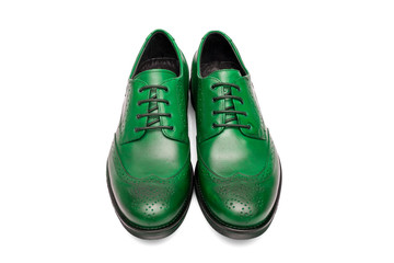 Pair of male green leather shoes on white background, isolated product, top view.
