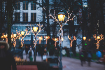 Christmas decorations in the historical center streets of Helsinki, with evening light illumination, concept of Christmas in Finland, with Cathedral, market square, christmas tree