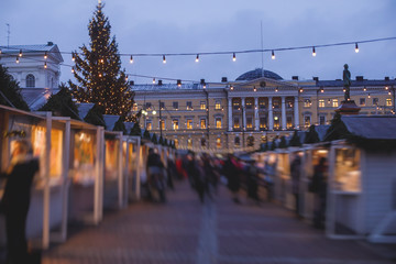 Obraz premium Christmas decorations in the historical center streets of Helsinki, with evening light illumination, concept of Christmas in Finland, with Cathedral, market square, christmas tree