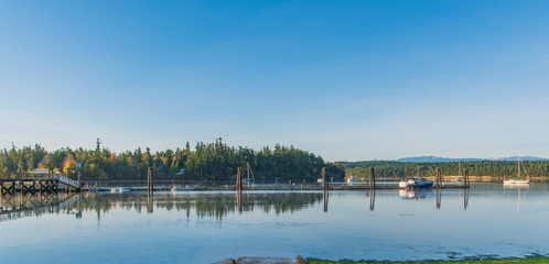 Morning Light on the Pier, Dock & Boats with Mirror-like Reflections in Mystery Bay on Marrowstone Island in October