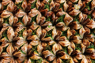 Traditional Middle Eastern dessert baklava with pistachio nuts. Popular puff pastry with nuts in syrup.