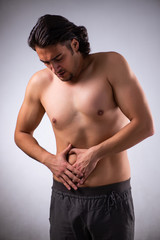 Young man suffering from stomachache