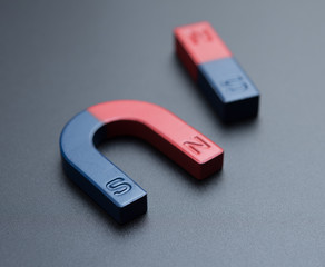 U shape steel magnet and bar magnet on gray background. © showcake