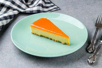 Cheesecake passion fruit on grey table