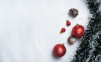 Christmas decoration with balls on snow with copy space