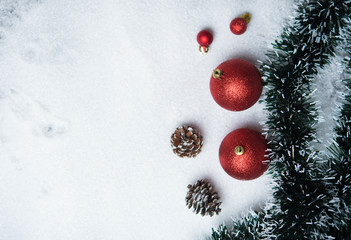 Christmas decoration with balls on snow with copy space