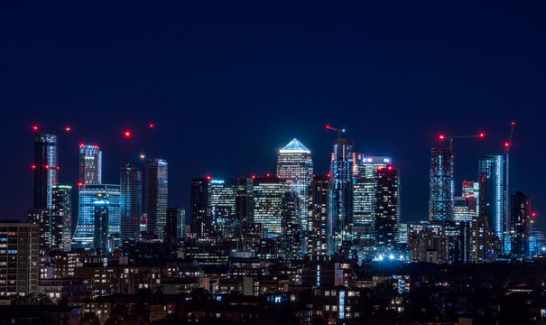 London / United Kingdom - October 4th 2019: Night panorama of the Canary Wharf financial district taken from Blackheath
