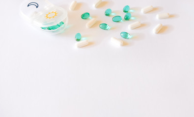 Pills case and capsules background.