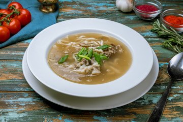 lamb noodle soup on wooden table